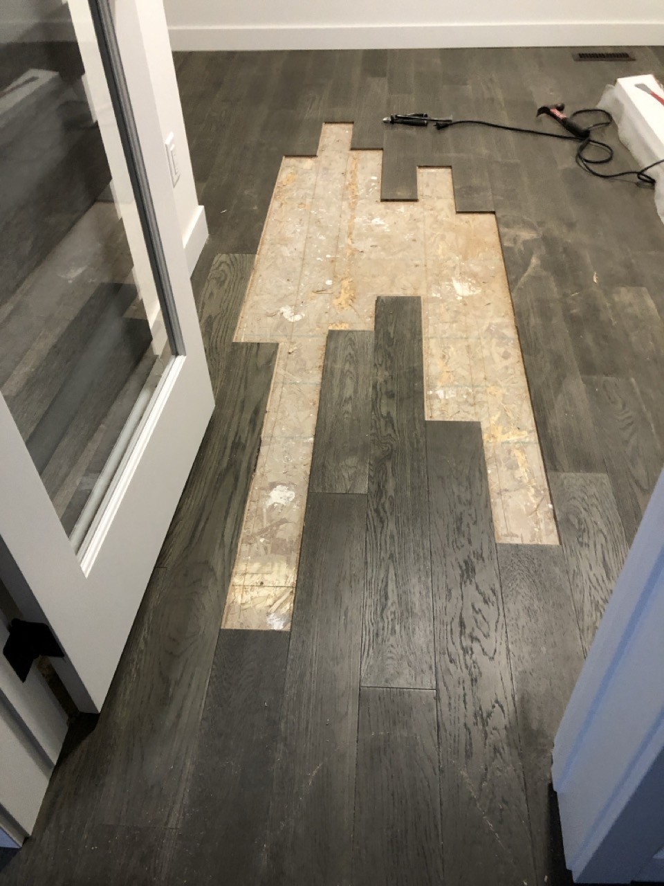 This Engineered hardwood was removed and repaired due to the dyelot being inconsistent.